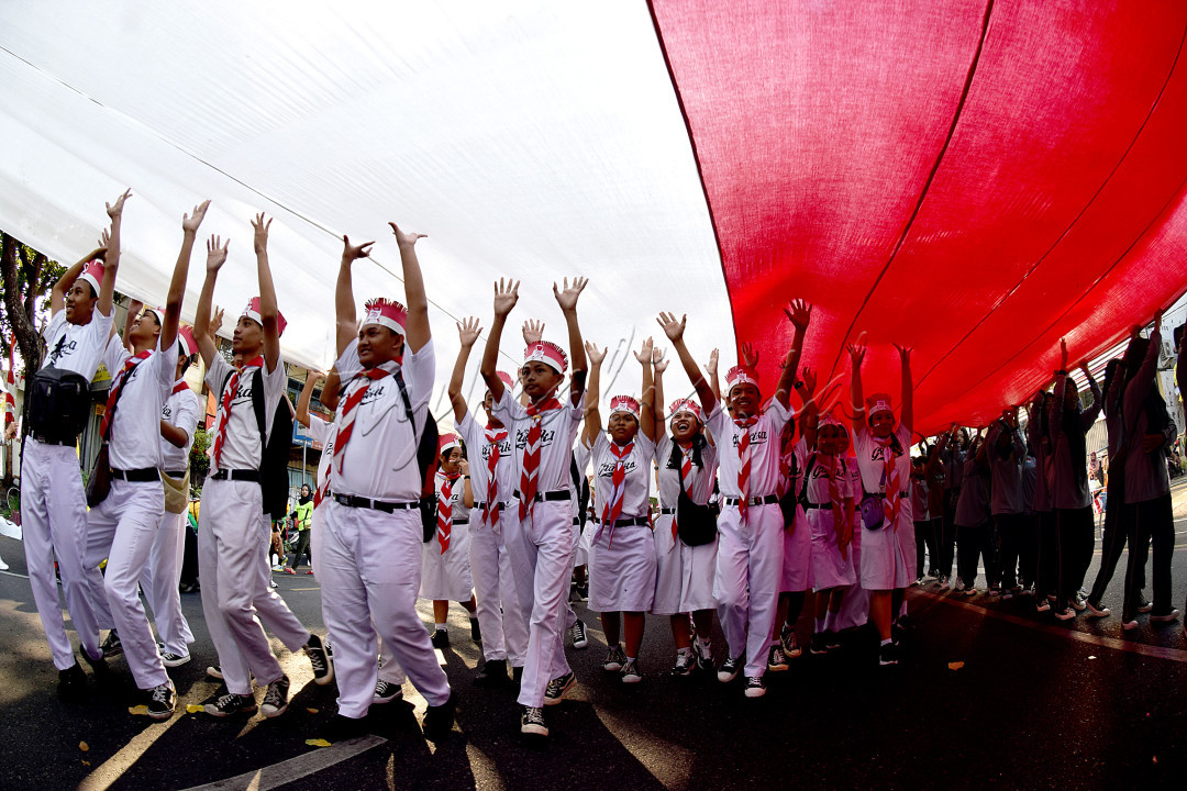 Semangat generasi milenial dalam kebersamaan menjunjung Sang Saka Merah Putih, menggerakkan perekonomian global dan perubahan, demi menuju Indonesia Emas.&nbsp;